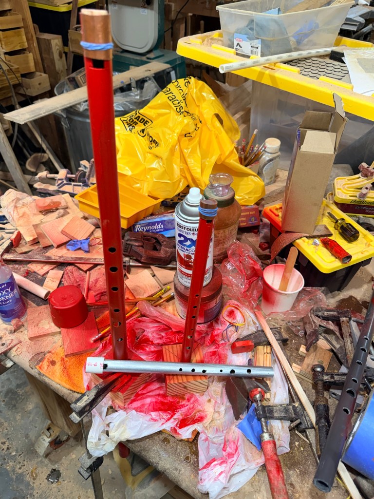 F and D whistles in the process of being painted